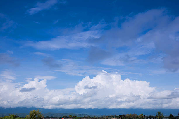 large mountain view, abundant with trees with blue sky and clouds in Thailand