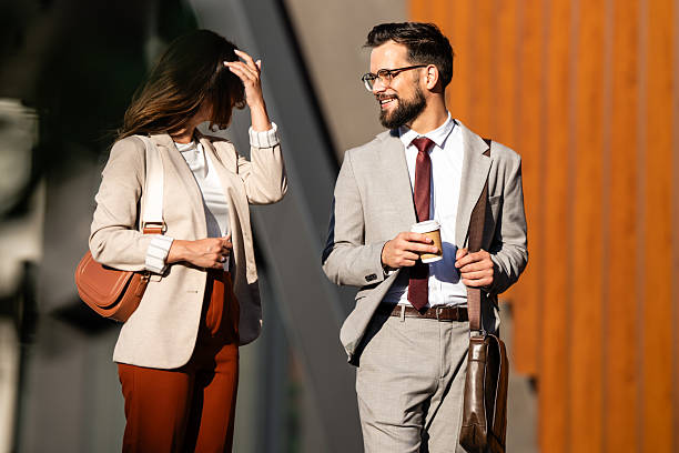istock Businesspeople walking and talking during coffee break outdoors 2230907734