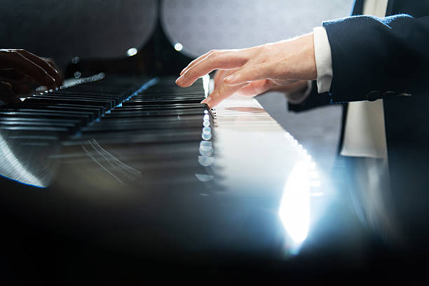 Woman's hands playing the piano