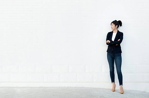 Confident woman standing with arms crossed