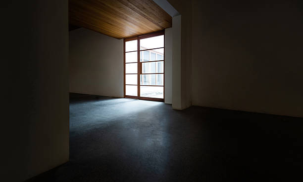 istock Empty room interior with concrete floor and wood ceiling 2230910976