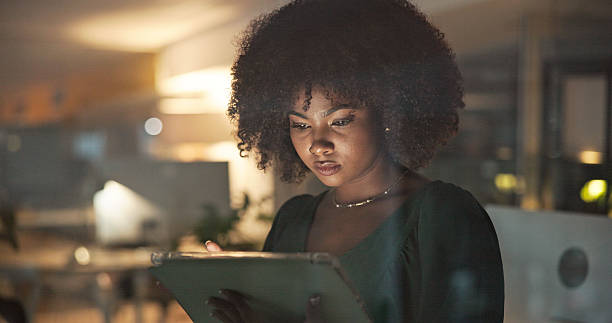 istock Focused Businesswoman Working Late in Modern Office Environment 2230913230