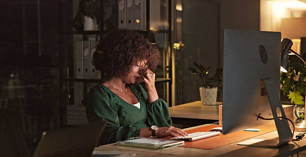 istock Focused Professional Working Late at Night in a Modern Office Environment 2230913245