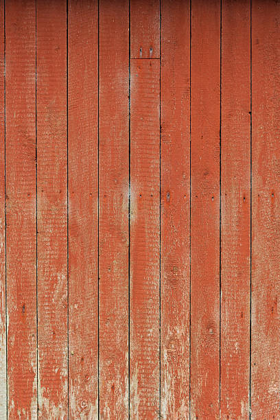 istock Weathered red wooden wall shows texture and grain, hinting at history and rustic charm in a rural setting 2230914245