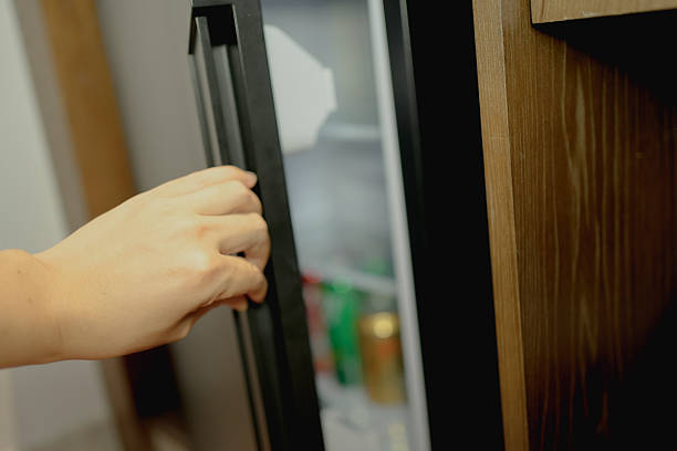 istock Open the refrigerator door with one hand 2230915163