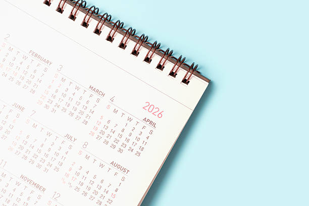 istock Paper calendar for 2026 on blue background close-up top view. 2230916439