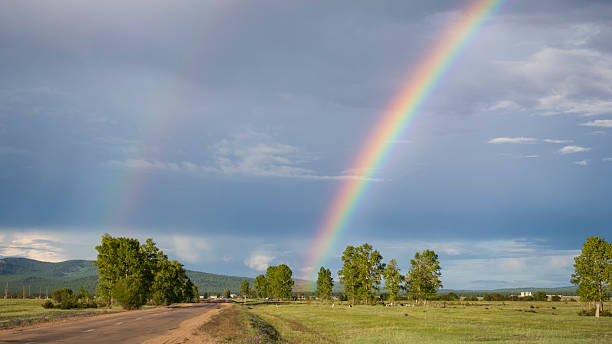 istock Rainbow over the small village in Siberia 2230921924