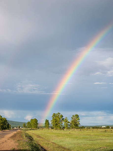 istock Rainbow over the small village in Siberia 2230921926