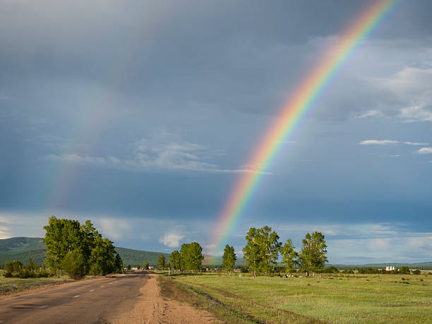 istock Rainbow over the small village in Siberia 2230921928