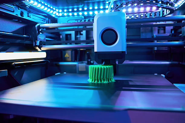 Innovative 3D Printer Creating a Detailed Green Object in a Modern Workspace With Advanced Technology stock photo