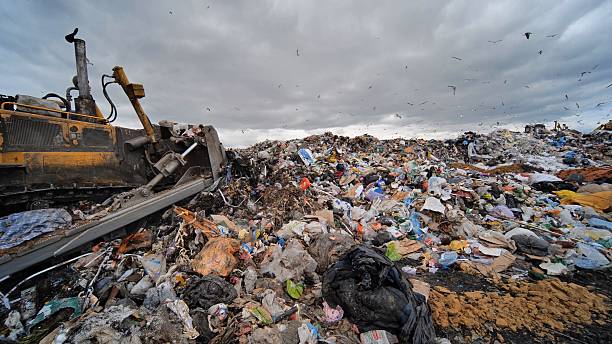 istock Work of a bulldozer at a landfill. 2230925229