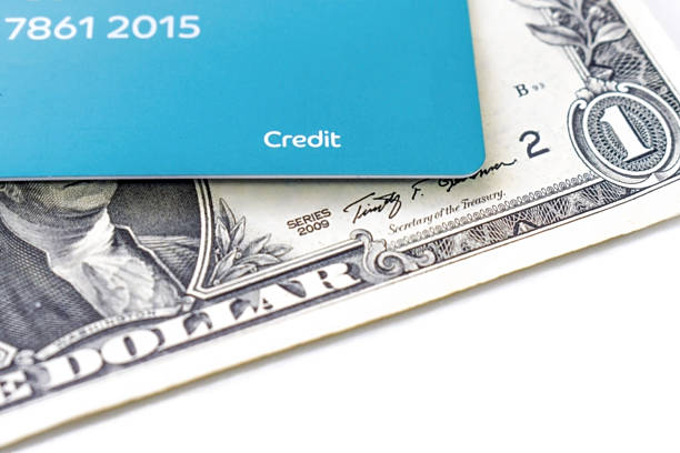 Credit card with US dollar bill on the table. Business and finance concept.