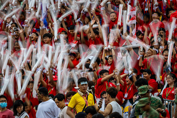 Huge group of spectators at the Padang, parade ground of the Singapore National Day Parade 2025.