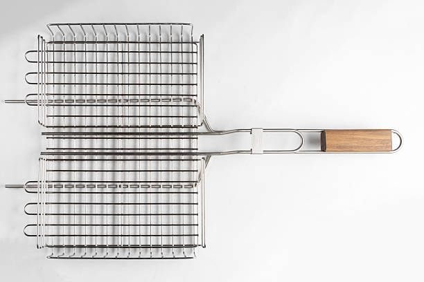 metal grill basket isolated on gray background, top view