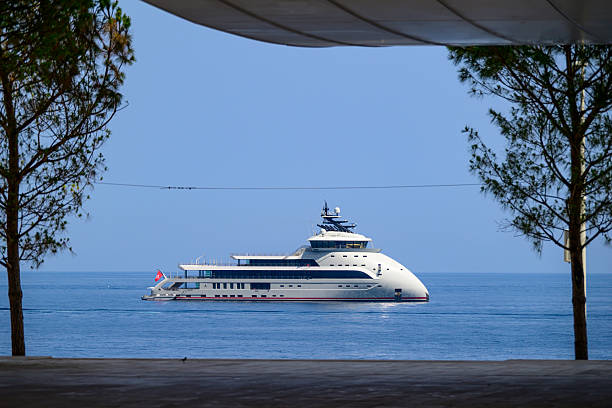 Yachts Olivia O in the Mediterranean sea in the bay at Monaco and Baie de Roquebrune during a beautiful summer day on the Côte d'Azur.