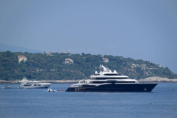 Yachts in the Mediterranean sea in the bay at Monaco and Baie de Roquebrune during a beautiful summer day on the Côte d'Azur.
