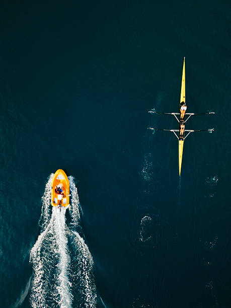 istock Rowing Team and Motorboat Aerial View 2230933965