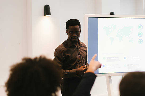 istock Businessman leading presentation about global strategy in modern office 2230936341