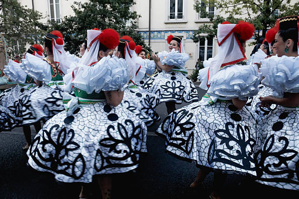 Lisbon, Portugal - June 12, 2024: Women dressed in traditional folklore costumes, prepare to parade in Lisbon downtown during this city celebrations of the Popular Siants.