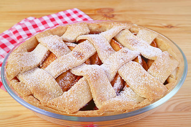 Mouthwatering freshly baked tasty and healthy apple pie on wooden table