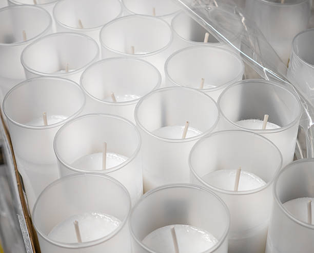 istock White paraffin candle inserts for the cemetery, many pieces close up 2230944567