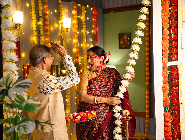 istock Old couple enjoying at home during Diwali 2230945331