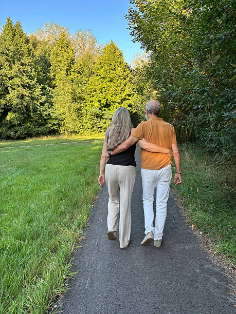istock Close Senior Couple having a walk in the Park. 2230945523