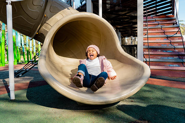 three years old child lying Unconscious on the playground floor