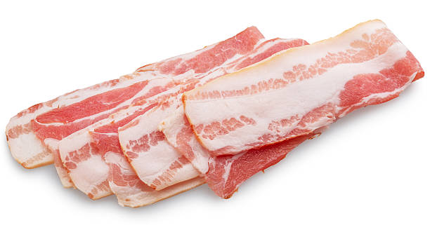 istock Slices of salted and cured uncooked bacon on white background. Clipping path. 2230946006