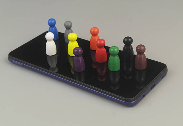istock Group of different people figures on smartphone. 2230948014