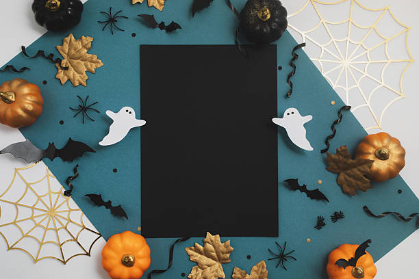 istock Halloween mockup with empty black paper card with festive decorations top view. Happy Halloween party background flat lay. 2230950970