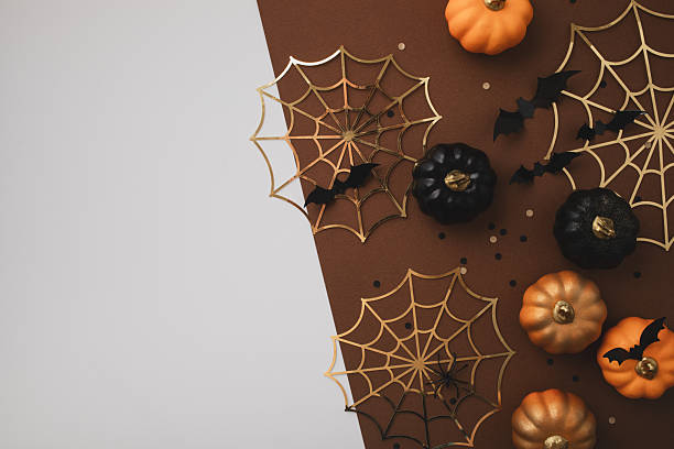 istock Halloween background with party decorations from pumpkins, bats, spiderweb top view. Mystic autumn greeting card. 2230951017
