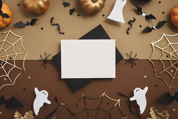 istock Halloween party composition with empty card from envelope with festive decoration from pumpkins, bats, spider web, ghosts top view. 2230951035