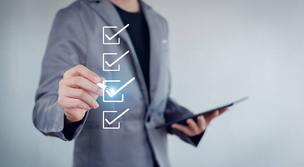 istock Businessman mark checkboxes, Survey form, check marks on checklist,Checklist concept. 2230954819