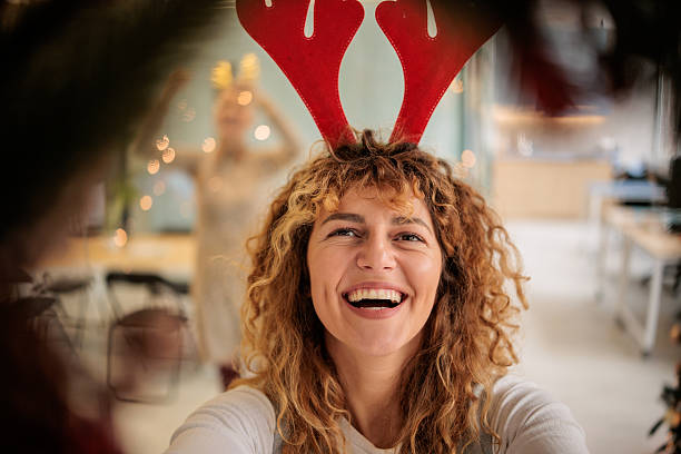 istock Women Colleagues Creating Festive Workplace 2230955057