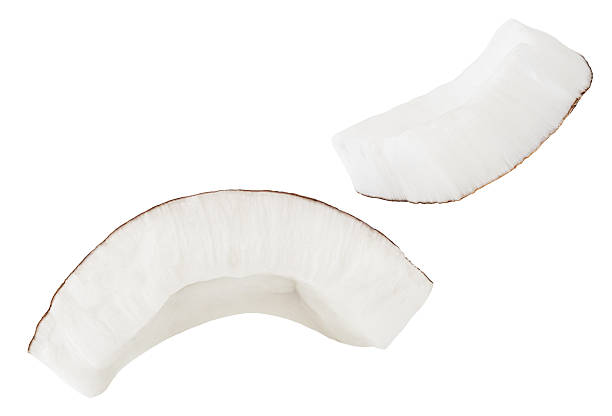 istock Isolated Coconut pieces falling on white background. Coconut explosion with broken pieces. Levitating coco nutslices  Top view. Flat lay. Pattern  2230956635