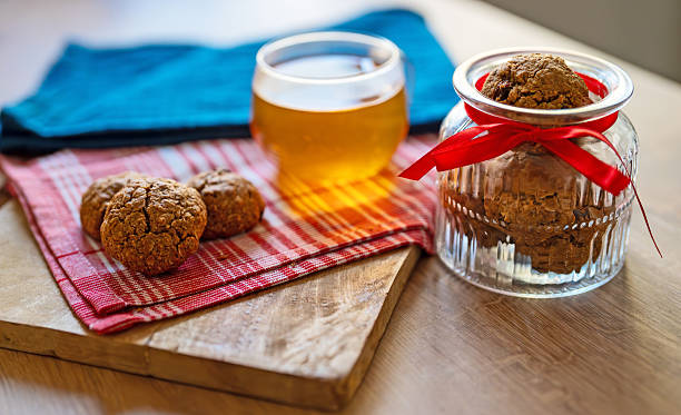 Cup of tea with oatmeal raisin cookies.