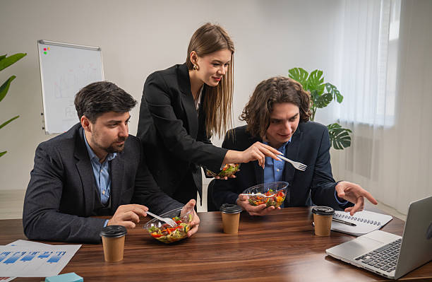 istock Team Discussing Project Details Over a Casual Lunch Meeting 2230957093
