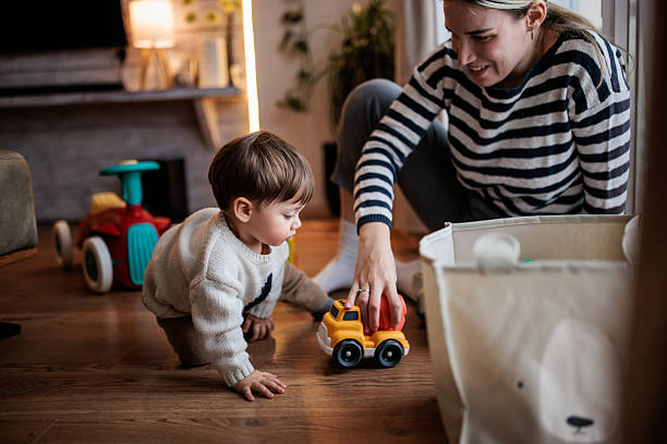 istock Smiling Mom Playing with Baby Boy 2230959532