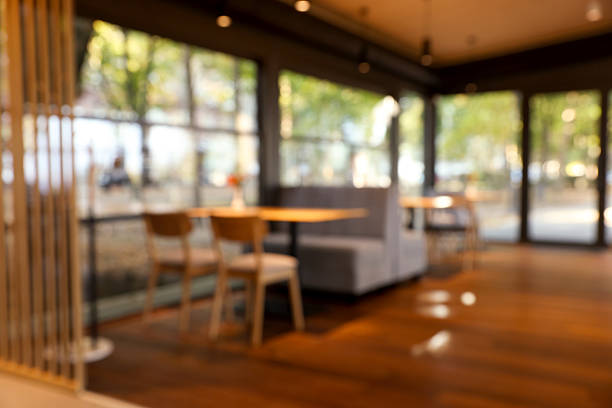 Blurred view of stylish cafe with large windows