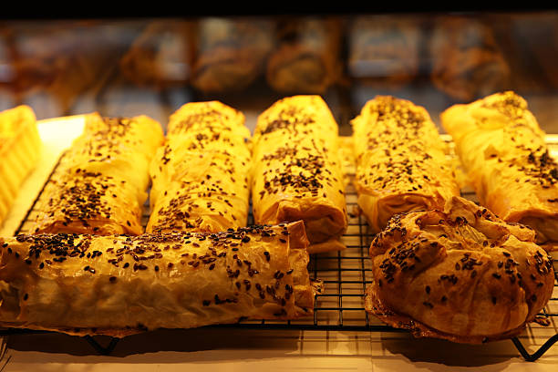 istock Tasty puff pastries on display in cafe, closeup 2230961241