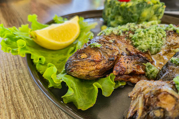 Grilled trout on the plate in a restaurant.