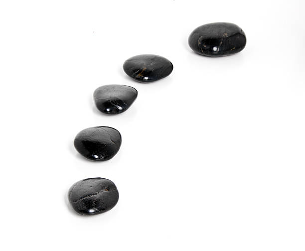 Balanced black stones: symbol of tranquility and peace