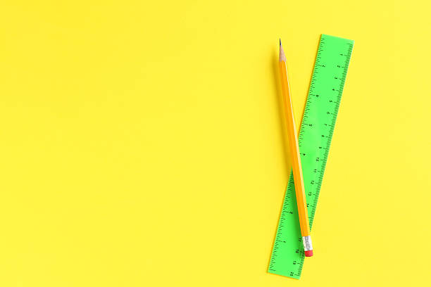 istock Ruler and pencil on yellow background, top view. Space for text 2230961801