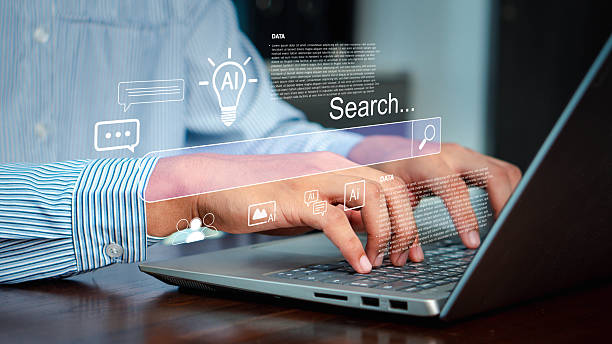 istock Businessman typing on laptop with futuristic AI search bar, big data, and digital interface, representing artificial intelligence, SEO, online research, and modern technology. 2230963014