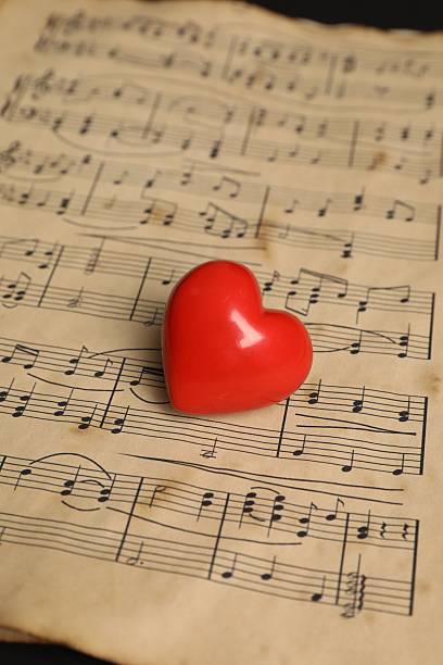 istock Heart figure and musical notes on black background, closeup 2230964539