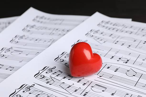 istock Heart figure and musical notes on black background, closeup 2230964543