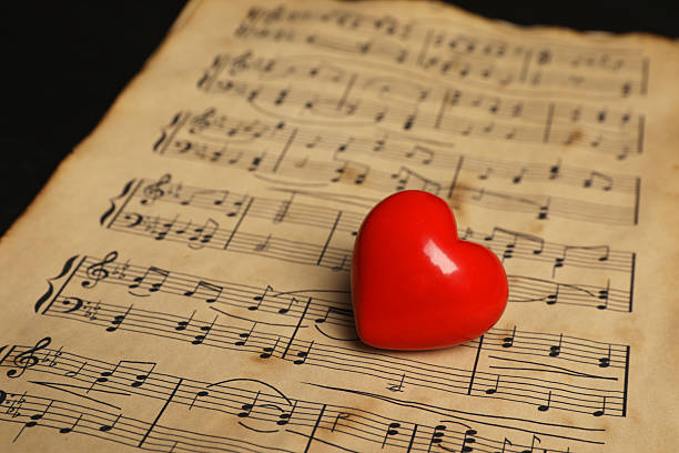 istock Heart figure and musical notes on black background, closeup 2230965054