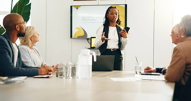 istock Business people, presentation or woman in office, negotiation or info with startup development. Group, collaboration or workshop for profit increase, speaker or seminar with brainstorming or feedback 2230965272