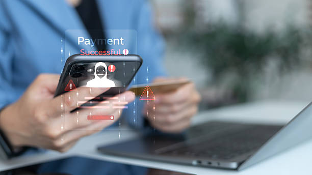 istock Close-up of a smartphone showing a hacker warning and a payment successful alert, symbolizing online scam, payment fraud, cybercrime, and financial security risk. 2230967282